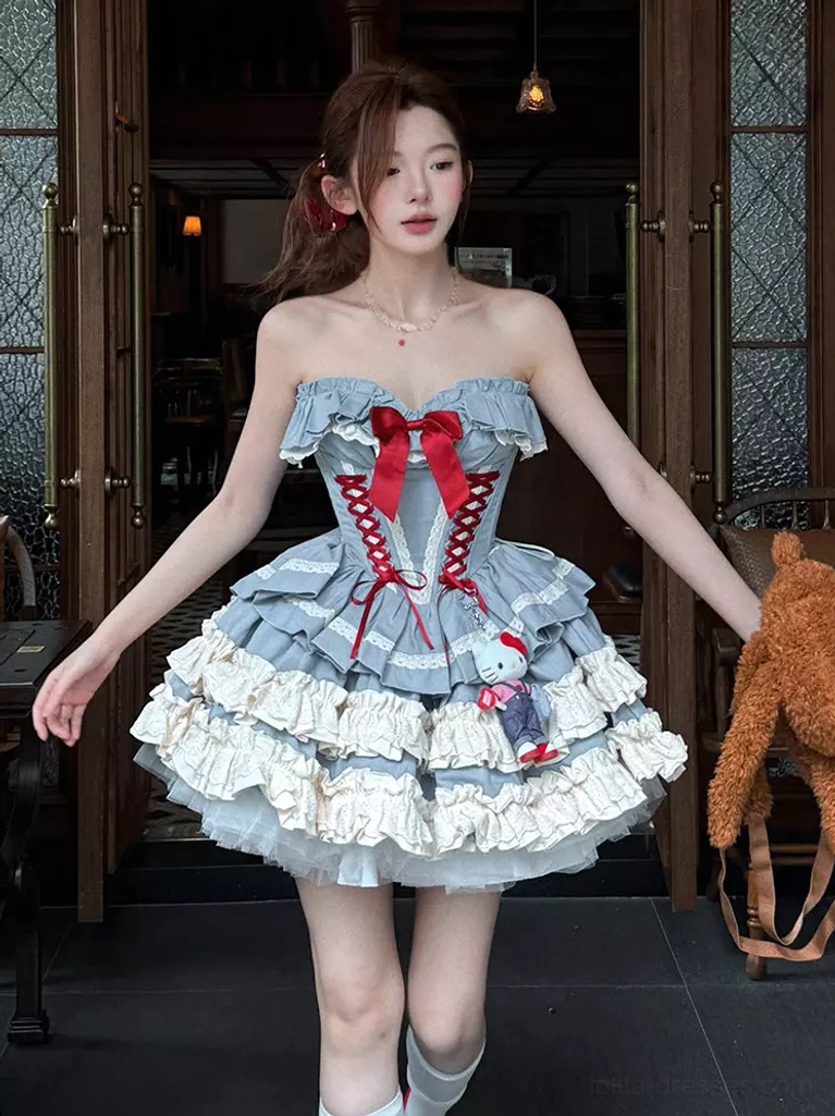 Full front view of blue ballet lolita dress in vintage indoor room, styled with white knee-high socks, tiny teddy bear charm detail on skirt, and ruffled hemline