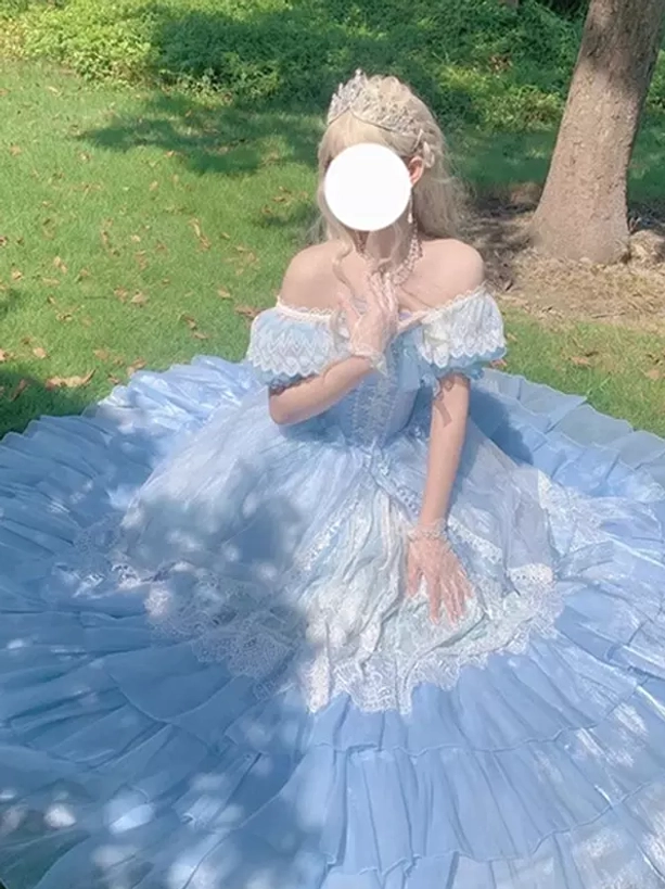 Blue princess fairy Lolita dress low front angle showing lace-decorated bodice, lace-up front closure, and full spread skirt with ruffled layers