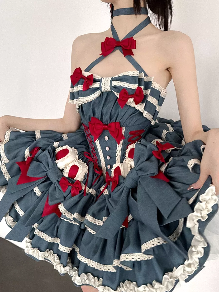 Blue halter sweet lolita dress front view with red bows and layered white lace ruffle skirt on female model