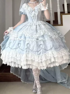 Sweet lolita blue wedding gown side profile showing v-neck bodice front bow embroidery layered lace ruffles and pearl accessories