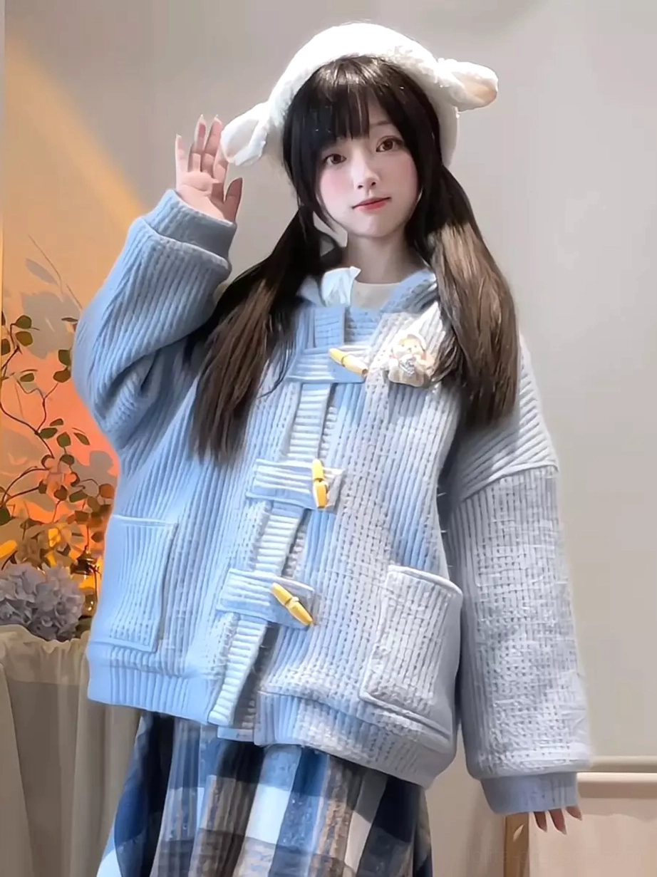 powder blue sweet lolita toggle coat with fluffy collar brooch and oversized patch pockets full body front view indoor scene
