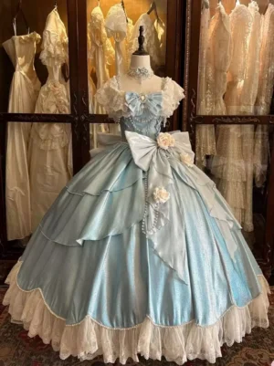 Light blue lolita wedding ball gown front view featuring ruffled cap sleeves, oversized front bow with white roses, layered satin skirt with lace hem trim, and rhinestone chest embellishments - sweet lolita style