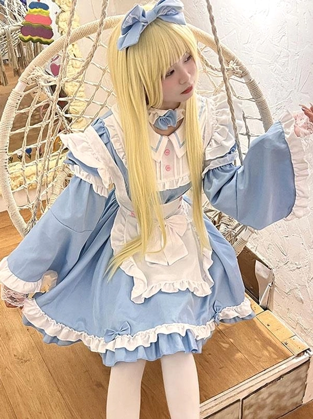 Light sky blue maid lolita dress side view ruffled hem white apron matching blue hair bow indoor hanging chair background