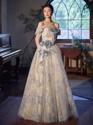 Blue off-shoulder Lolita ball gown with 3D floral embroidery and gold embellishments, full front view on model in vintage Victorian room setting