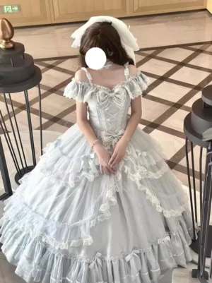 Blue lolita princess wedding dress modeled by girl with bridal headwear, showcasing off-shoulder ruffled sleeves and full tulle skirt