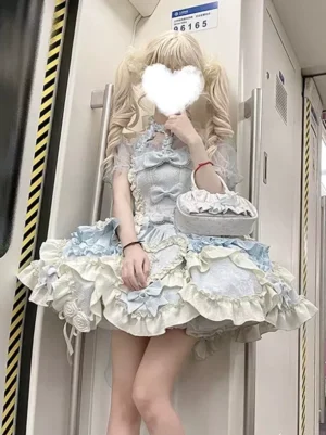Blue sweet ballet lolita dress halter neckline sleeveless with ruffled train front view on blonde model wearing matching handbag and platform heels
