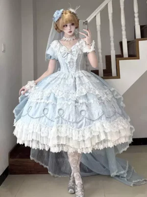 Blue sweet lolita bridal dress full front view with short puff sleeves lace-up ruffles and dramatic train on blonde model in bridal veil