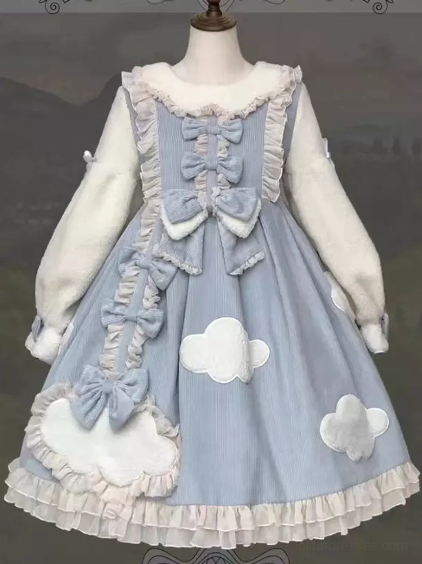 Blue lolita dress on mannequin flat front display plush sleeves multiple bows cloud patches ruffled hem