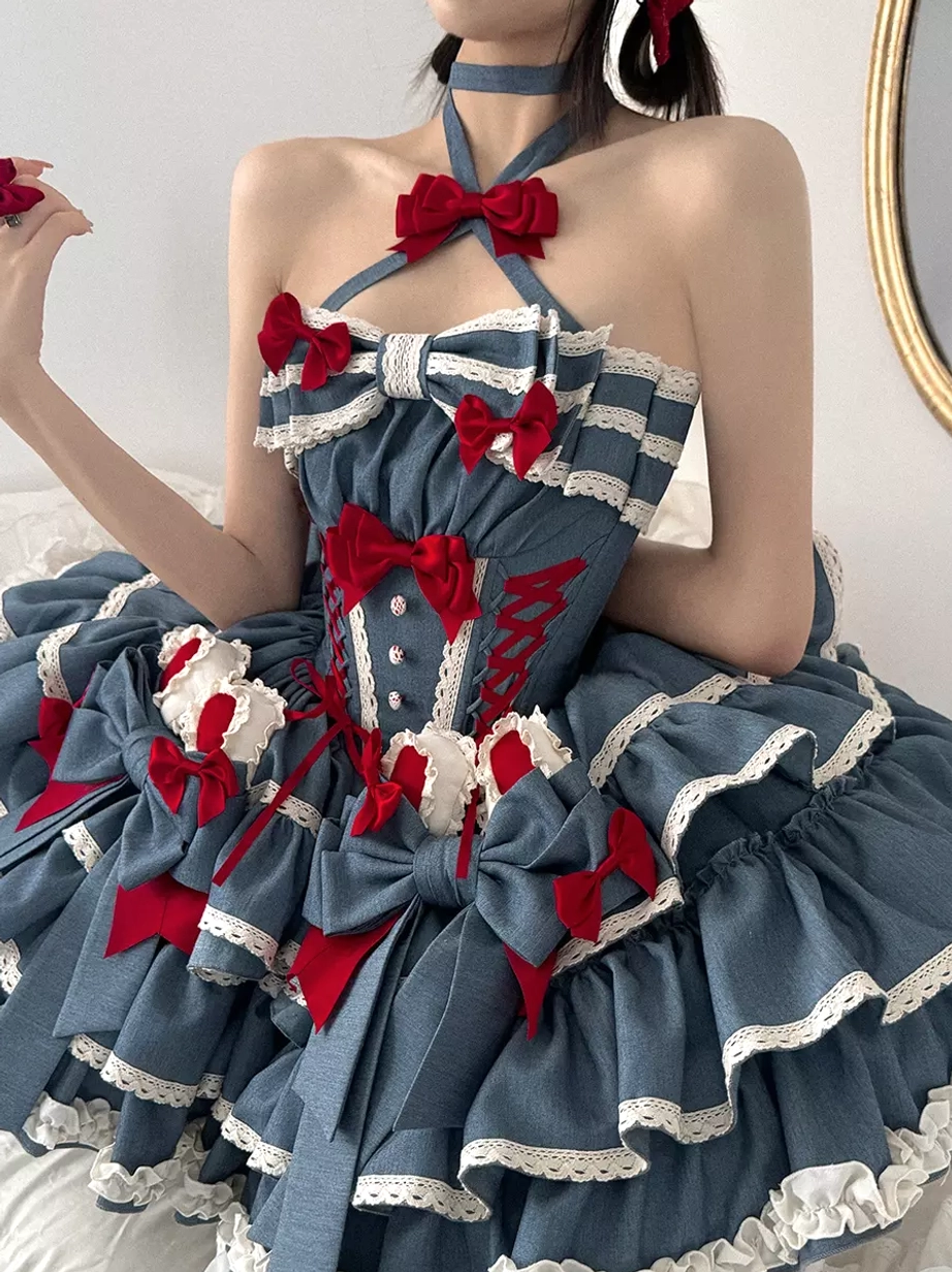 Three-quarter front view of blue sweet lolita dress with halter red bow and blue-white-red color scheme large skirt bows
