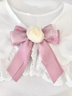 Blush pink sheer organza bow hair clip with cream rose decoration paired with white lace collar, front overhead view of sweet lolita floral accessory