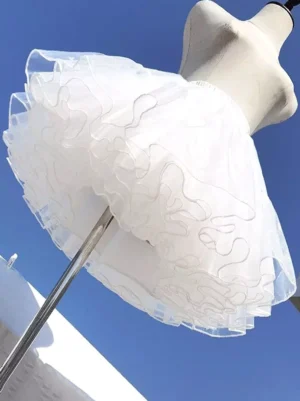 Boneless soft tulle mini petticoat white lolita underskirt side view showing fluffy ruffled silhouette on dress form mannequin