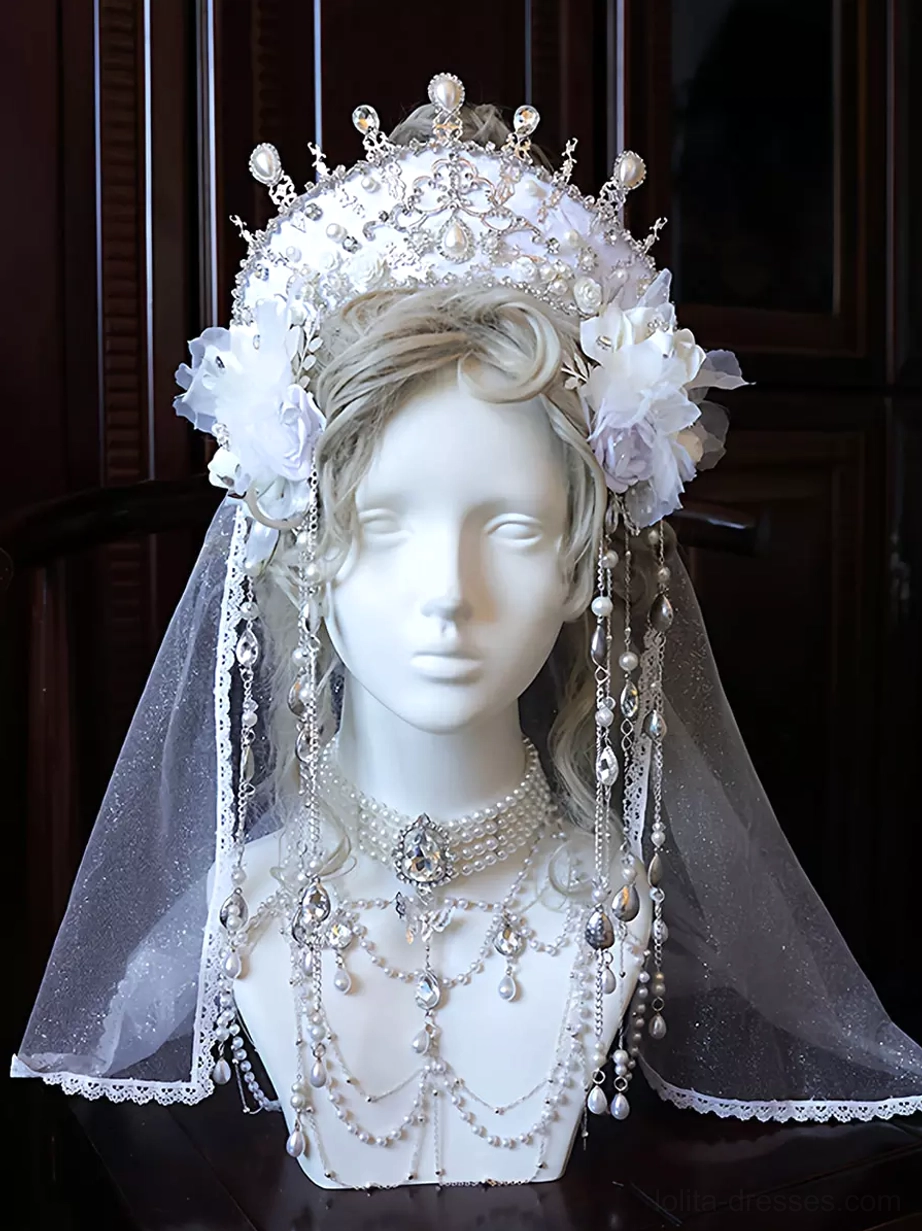Bridal lolita crown headpiece front view with white tulle veil, silver crystal pearl crown, purple fabric flowers, and cascading dangle chain jewelry set on blonde mannequin head
