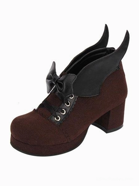 Brown Gothic Lolita chunky heel pumps with bat wing bow and lace-up metal eyelets, single shoe front view demonstrating round toe construction