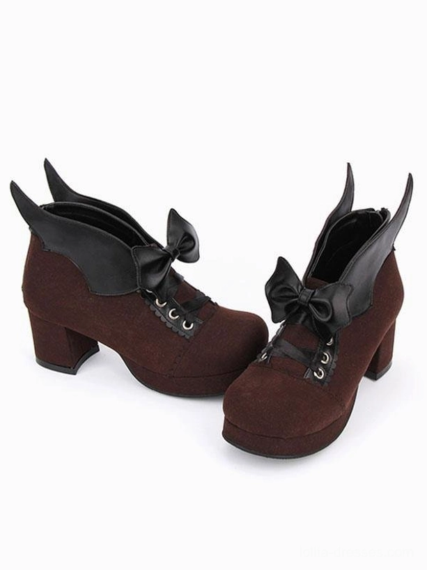 Pair of brown Gothic Lolita chunky heel pumps with bat wing bow detail and suede texture, front view showing block platform heels and matching coordination