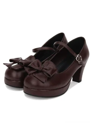 Dark brown Lolita Mary Jane platform pumps with bow ornament and buckle ankle strap, front side view showcasing block heel construction and PU leather finish