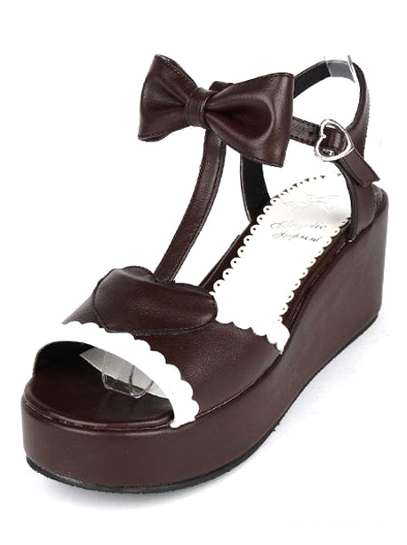 Brown Lolita wedge sandals side view showing thick platform sole heart-shaped ankle buckle and bow decoration sweet fashion footwear