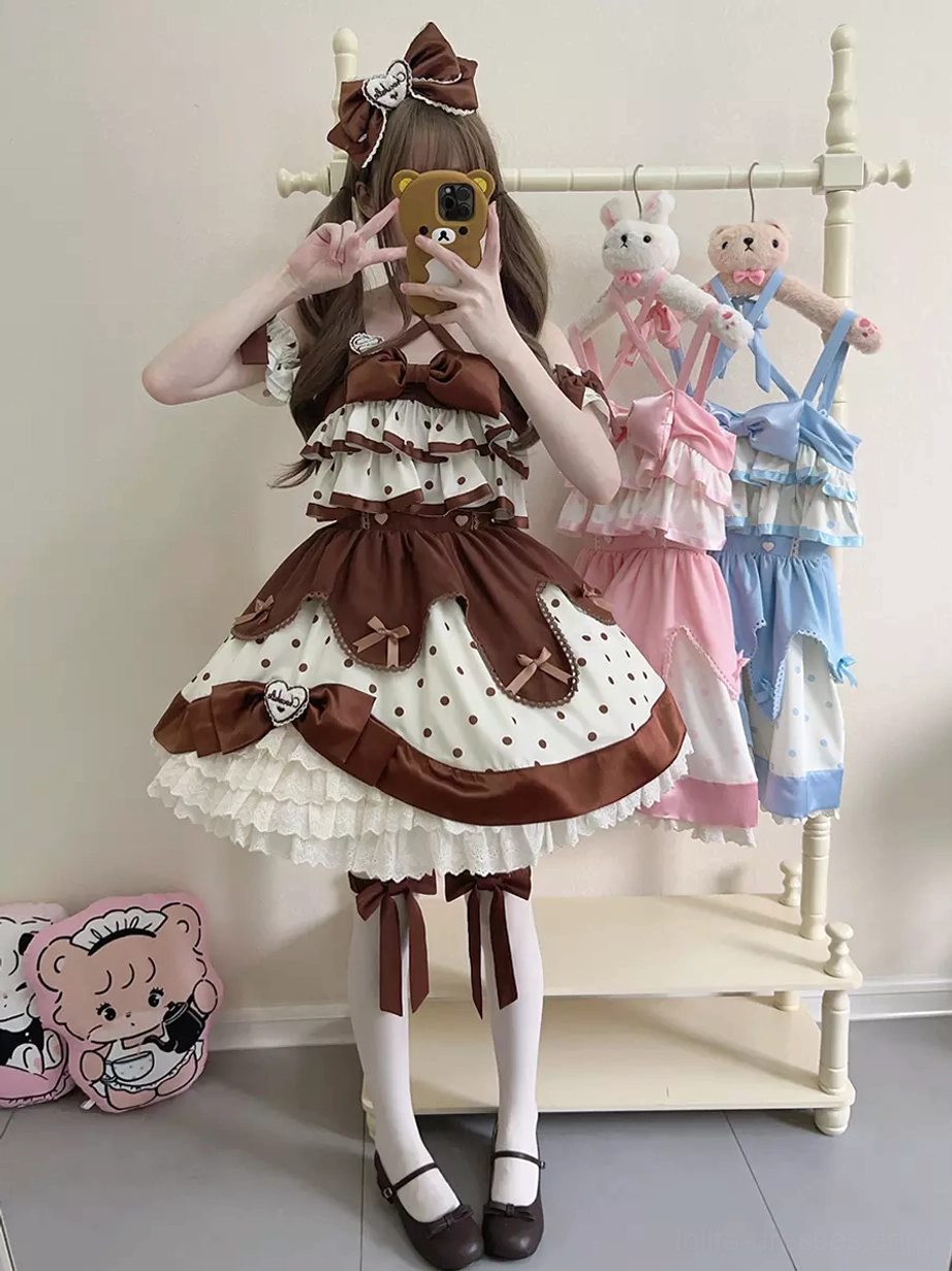 Full-length sweet lolita jumper dress in brown and white polka dot pattern with matching leg ribbons, closed toe flat shoes, and complete coordinate styling