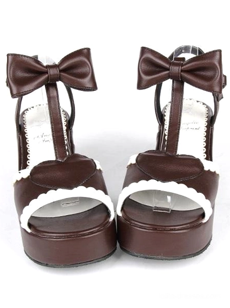 Brown PU leather Lolita platform sandals front view with bow ankle strap heart-shaped buckle and white scalloped peep toe trim flat lay
