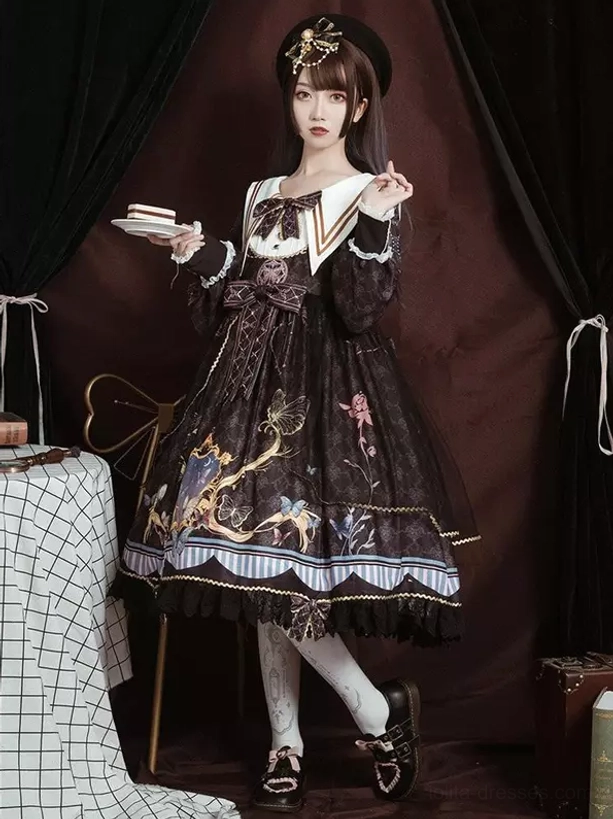 Brown sailor lolita dress three-quarter front view with printed skirt, lace-trimmed hemline, sailor collar detail, and decorative hair accessory
