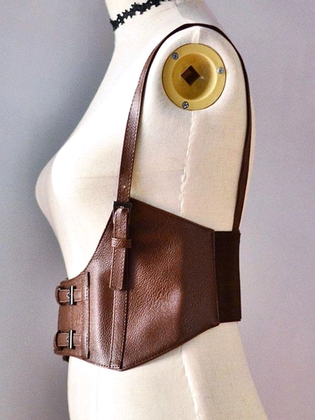 Left side profile view of brown PU leather steampunk lolita corset showing side adjustment buckles and pebbled texture detail