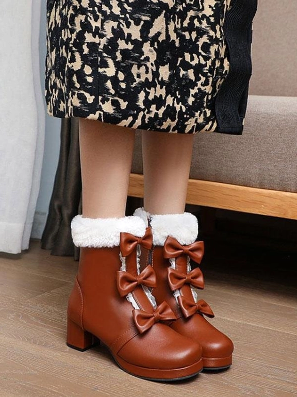 Brown Sweet Lolita ankle boots flat lay view on wooden floor with double bows, decorative lace trim, fuzzy fur cuff, and chunky heel