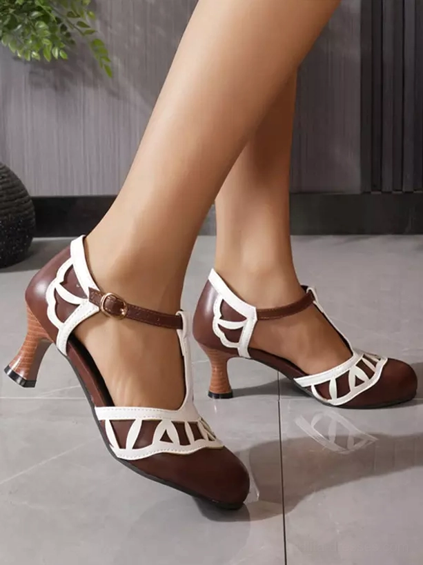 Brown and white sweet Lolita pumps rear side view on model, showcasing carved heel design and geometric cutout patterns