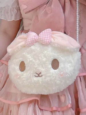 Bunny plush crossbody bag front view worn with pink heart lolita dress featuring pearl chain shoulder strap and cheek pearl embellishments sweet lolita coordinate