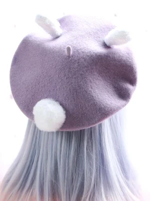 Purple wool bunny ear lolita hat back view showing white pom-pom tail embellishment and rear ear details kawaii headdress