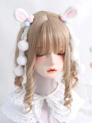 Sweet lolita bunny ear hair ornament headdress displayed on mannequin with lace collar, angled front shot highlighting tassel pom-pom arrangement and pastel color coordination for lolita tea party wear
