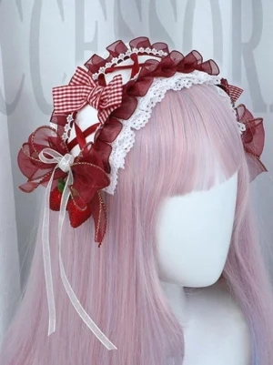 Wine red gingham Sweet Lolita headband with organza bows and strawberry charms worn on pink long wig mannequin front view showing plaid pattern and delicate lace trim details