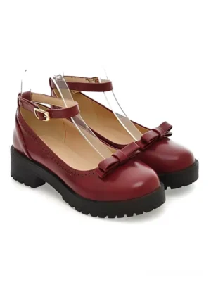 Burgundy lolita ankle strap pumps with bow embellishment front three-quarter view round toe brogue perforations