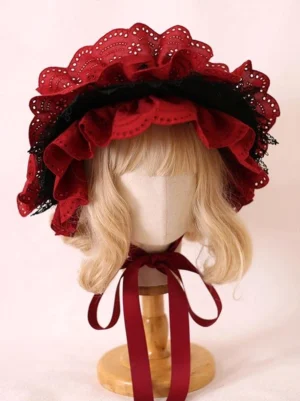 Close-up detail of burgundy Lolita headdress showing double-layered ruffled lace, black lace trim edges, and wine red ribbon chin straps