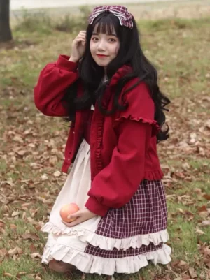 Burgundy lolita hooded coat side three-quarter outdoor view with model wearing plaid skirt autumn setting