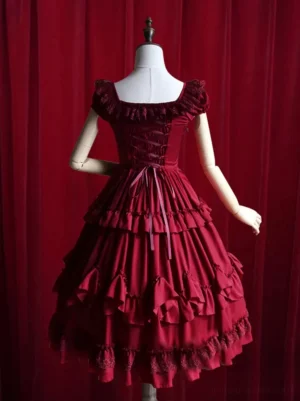Burgundy lolita dress back view showcasing ribbon corset lacing and matching ruffled neckline detail
