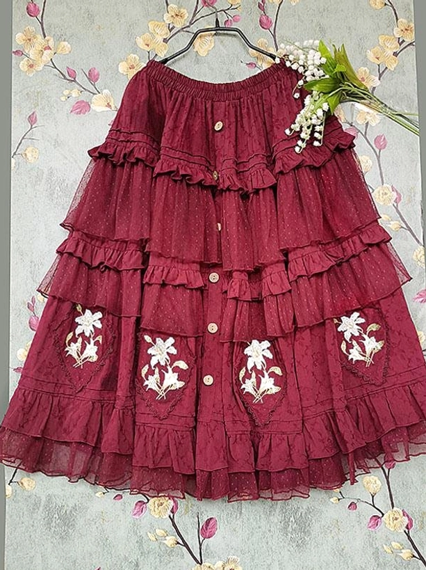 Burgundy off-shoulder tiered Classic Lolita dress flat lay hanging view showing front button details and layered tulle ruffled skirt with embroidered florals
