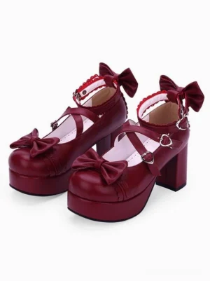 Burgundy lolita platform shoes with bow straps heart-shaped buckles and ruffled ankle trim paired display three-quarter front view
