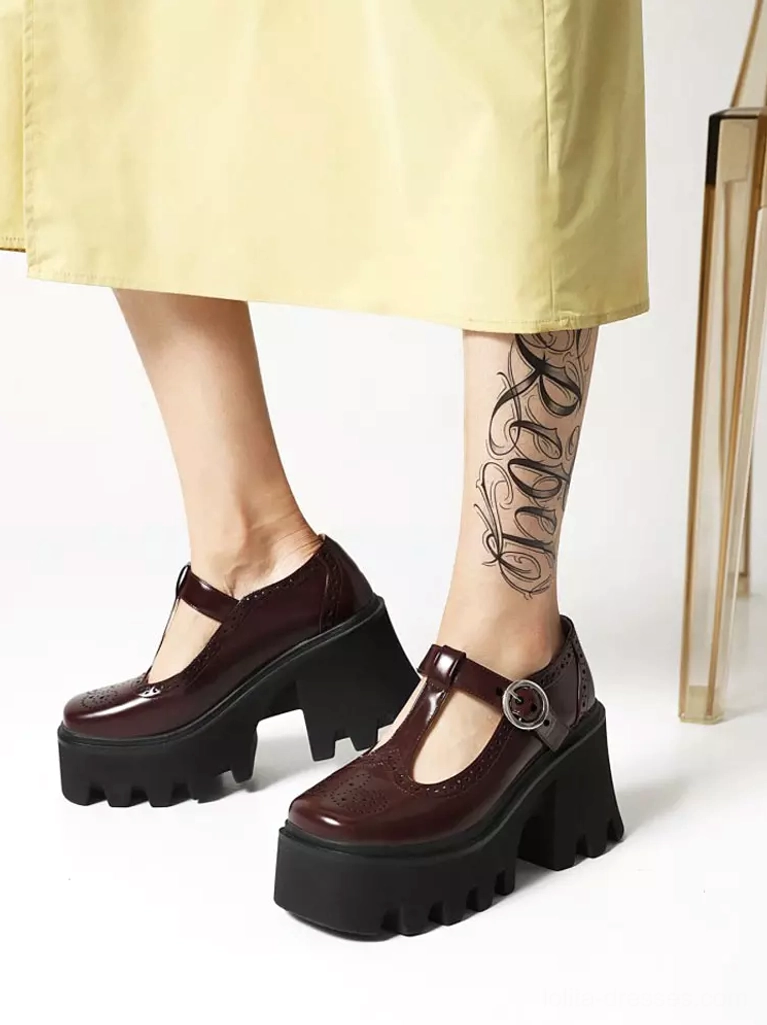 Burgundy PU leather lolita T-strap platform pumps close-up front showing brogue toe cap and metal buckle fastening