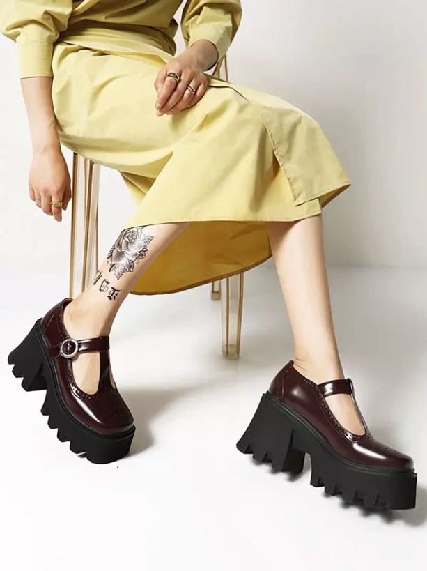 Full lower body styling of burgundy lolita T-strap platform pumps worn with yellow dress showing complete aesthetic coordination