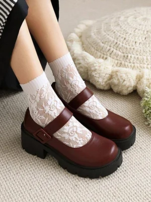 Top-down front view of burgundy lolita Mary Jane pumps with smooth PU leather finish and thick black platform sole worn with lace socks