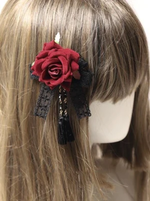 gothic lolita burgundy rose hair accessory styled on light brown long straight hair mannequin back view with black lace bow beaded tassel