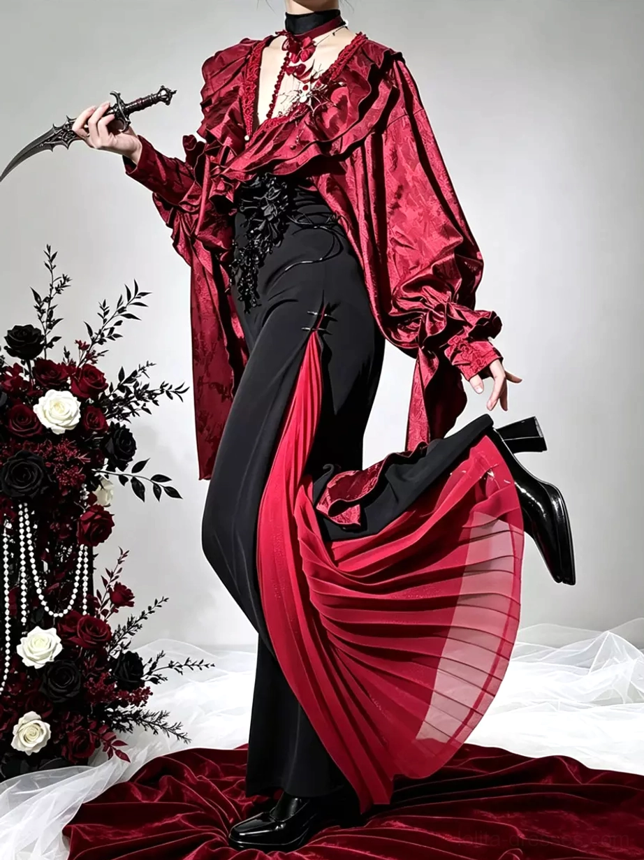 Burgundy ruffle gothic lolita vampire outfit with black wide-leg pants featuring red pleated side panels, styled with dramatic prop dagger on red velvet studio background