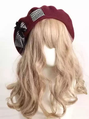 Burgundy Lolita beret hat accessory featuring houndstooth pattern accents and elegant black satin bow on model wearing wavy blonde wig, authentic Sweet Lolita aesthetic