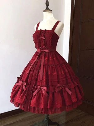 Burgundy sweet lolita jumper skirt dress with layered ruffles and waist bow front flat view on mannequin