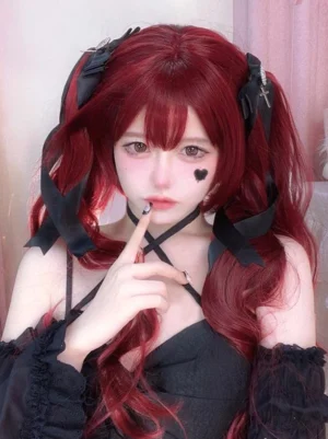 Burgundy twin-tail long wavy lolita wig worn by model in full gothic lolita outfit with black satin bow accessories and cross hairpins