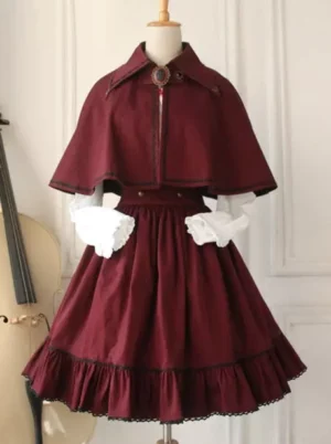 Burgundy vintage military style lolita cape with ruffled skirt edge and contrast trim on mannequin