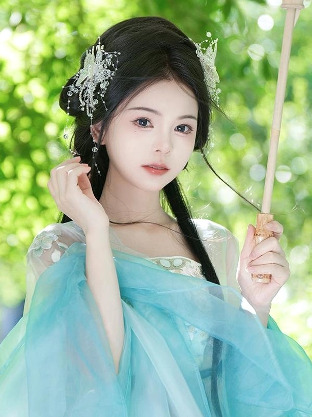 Dual side butterfly hair ornaments front medium shot with hanfu model holding traditional wooden prop displaying iridescent crystal design
