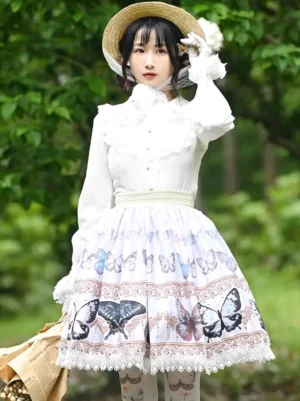 Butterfly print sweet lolita skirt full-body front view with lace hem trim matching waistband fabric and white blouse model holding vintage brown bag