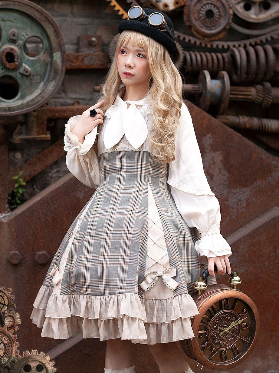 Steampunk-inspired Lolita dress set with camel tones, big bow necktie, and ruffled skirt against industrial mechanical background