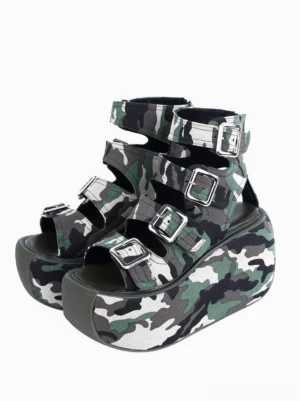 Camo gladiator platform sandals front three-quarter view showing multiple silver buckle straps, open round toe, woodland camouflage textile upper, thick flatform sole, gothic lolita summer shoes