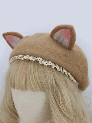 Kawaii cat-ear lolita hat with pink inner ears and cream lace trim front-right perspective on display